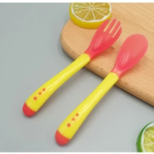 Waterproof and Safe Baby Feeding Spoons with Extended Handle for Parents to Feed Their Little Ones